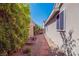 Side yard with rock landscaping along the home's exterior at 816 Stannard Ct, Henderson, NV 89052