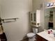 Clean bathroom with cabinet storage, vanity, toilet, and shower with curtain at 833 Aspen Peak Loop # 2613, Henderson, NV 89011