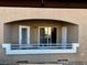 Cozy covered patio space with white railing and arched ceiling, perfect for relaxing at 833 Aspen Peak Loop # 2613, Henderson, NV 89011