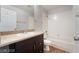Bathroom featuring a single sink vanity and a shower-tub combo at 8600 W Charleston Blvd # 1043, Las Vegas, NV 89117