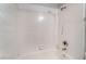 Bright bathroom featuring a tiled tub with white tile surround and shower at 8600 W Charleston Blvd # 1043, Las Vegas, NV 89117