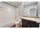 Clean bathroom featuring a combined shower-tub, toilet, and vanity with storage at 8600 W Charleston Blvd # 1043, Las Vegas, NV 89117