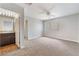 Neutral bedroom with carpet, ceiling fan, and doorways to bathroom and closet at 8600 W Charleston Blvd # 1043, Las Vegas, NV 89117