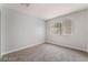Bright bedroom featuring neutral walls, plush carpet, and a window with blinds at 8600 W Charleston Blvd # 1043, Las Vegas, NV 89117