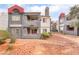 Charming apartment building with red accents, balconies, and well maintained desert landscaping at 8600 W Charleston Blvd # 1043, Las Vegas, NV 89117