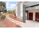 Exterior view of the building with well-manicured landscaping and pathway to entrance at 8600 W Charleston Blvd # 1043, Las Vegas, NV 89117