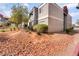 Exterior view of building showcasing desert landscaping and mature trees at 8600 W Charleston Blvd # 1043, Las Vegas, NV 89117