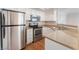 Kitchen featuring stainless steel appliances, white cabinets, and granite countertops at 8600 W Charleston Blvd # 1043, Las Vegas, NV 89117