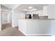Open kitchen with white cabinetry, stainless steel appliances, and a breakfast bar at 8600 W Charleston Blvd # 1043, Las Vegas, NV 89117