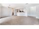 Open-concept living room with neutral paint, fireplace, and dining area at 8600 W Charleston Blvd # 1043, Las Vegas, NV 89117