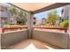 Cozy outdoor patio overlooking well-maintained landscaping and community buildings at 8600 W Charleston Blvd # 1043, Las Vegas, NV 89117