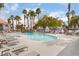 Relaxing community pool with lounge chairs and lush landscaping at 8600 W Charleston Blvd # 1043, Las Vegas, NV 89117