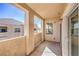 Outdoor patio area showcasing a stucco exterior and a view of the community and clear sky at 8777 W Maule Ave # 3090, Las Vegas, NV 89148