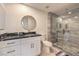 Modern bathroom with glass shower, stylish vanity, gold fixtures, and attractive stone design at 8777 W Maule Ave # 3090, Las Vegas, NV 89148