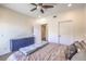 Bedroom view highlighting natural light and a stylish blue cabinet, with multiple doors at 8777 W Maule Ave # 3090, Las Vegas, NV 89148