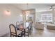 Bright and airy dining area with a modern table, chairs, and access to an outdoor balcony at 8777 W Maule Ave # 3090, Las Vegas, NV 89148