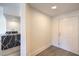 Entryway featuring sleek flooring and access to the kitchen with an island and modern fixtures at 8777 W Maule Ave # 3090, Las Vegas, NV 89148