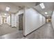 Long hallway with an elevator featuring tiled and carpeted flooring and recessed lighting at 8777 W Maule Ave # 3090, Las Vegas, NV 89148
