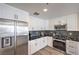 Well-equipped kitchen with stainless steel appliances, including a refrigerator and gas range with black backsplash at 8777 W Maule Ave # 3090, Las Vegas, NV 89148