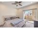 Comfortable main bedroom with a ceiling fan, slider to the balcony, and neutral décor at 8777 W Maule Ave # 3090, Las Vegas, NV 89148