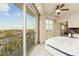 Bedroom with a private balcony, offering stunning city views and open to a dining area with a chandelier at 9101 Alta Dr # 307, Las Vegas, NV 89145
