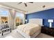 Bright bedroom featuring a large window with stunning city views and elegant decor at 9101 Alta Dr # 307, Las Vegas, NV 89145