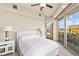 Bright bedroom with access to a private balcony, offering views of the surrounding cityscape and neighborhood at 9101 Alta Dr # 307, Las Vegas, NV 89145