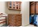 Walk-in closet featuring custom wood built-ins, drawers and cabinets for optimal storage and organization at 9101 Alta Dr # 307, Las Vegas, NV 89145