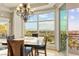 Elegant dining area showcasing a chandelier and picturesque views through expansive windows, perfect for entertaining at 9101 Alta Dr # 307, Las Vegas, NV 89145