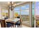 Cozy dining area adjacent to a balcony with picturesque city and mountain views at 9101 Alta Dr # 307, Las Vegas, NV 89145