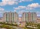 Luxury high-rise towers with lush landscaping and circular driveway entrance at 9101 Alta Dr # 307, Las Vegas, NV 89145