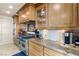 Gourmet kitchen with granite countertops, custom cabinetry, and stainless steel appliances for culinary enthusiasts at 9101 Alta Dr # 307, Las Vegas, NV 89145