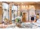 Elegant lobby showcasing a decorative fireplace, large windows with drapes, and designer furnishings at 9101 Alta Dr # 307, Las Vegas, NV 89145