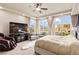 Bright main bedroom featuring city views, a seating area, and plush carpeting for added comfort and style at 9101 Alta Dr # 307, Las Vegas, NV 89145