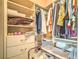 A walk-in closet with built-in shelving and drawers for optimal organization at 10 Via Visione # 103, Henderson, NV 89011