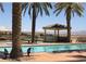 Inviting community pool area with gazebo, perfect for relaxation and recreation under the sun at 10 Via Visione # 103, Henderson, NV 89011