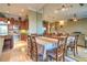 Open dining area and kitchen with stainless steel appliances and granite countertops at 10 Via Visione # 103, Henderson, NV 89011