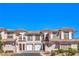 Beautiful townhome features desert landscaping and a unique Mediterranean-style roof at 10 Via Visione # 103, Henderson, NV 89011