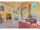 Stunning foyer with travertine floors, a chandelier, and seating area at 10 Via Visione # 103, Henderson, NV 89011