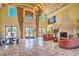 Grand foyer featuring travertine floors, a decorative ceiling, and elegant chandeliers at 10 Via Visione # 103, Henderson, NV 89011