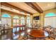 Spacious game room with pool table, wood floors, beamed ceiling, and elegant lighting at 10 Via Visione # 103, Henderson, NV 89011