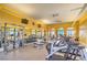 Community gym with cardio machines, weights, mirrors, ceiling fans, and natural light at 10 Via Visione # 103, Henderson, NV 89011