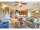 Inviting living room with an open floor plan, connected to the kitchen and stairway at 10 Via Visione # 103, Henderson, NV 89011