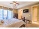 A secondary view of the main bedroom showing the door to the ensuite and balcony at 10 Via Visione # 103, Henderson, NV 89011
