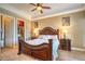 A traditional-style main bedroom featuring a walk-in closet and wood-look floors at 10 Via Visione # 103, Henderson, NV 89011