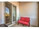 Cozy outdoor seating area with a comfortable red sofa, offering a relaxing retreat at 10 Via Visione # 103, Henderson, NV 89011