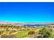 Expansive view of the golf course and lake surrounded by a mountain range at 10 Via Visione # 103, Henderson, NV 89011