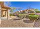Private backyard featuring desert landscaping, rock and bush ground cover at 10057 Bundella Dr, Las Vegas, NV 89134