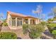 Exterior view of property featuring desert landscaping and a tile roof at 10057 Bundella Dr, Las Vegas, NV 89134