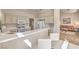 Bright kitchen showcasing a breakfast bar and seamless flow into the adjacent living area at 10057 Bundella Dr, Las Vegas, NV 89134